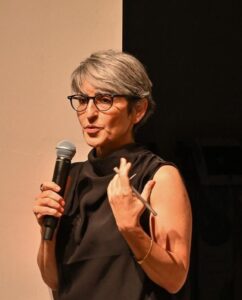 Image of Susan Abulhawa speaking into a microphone