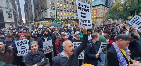 Image of David Kurnick holding an anti-Israel sign at a campus protest