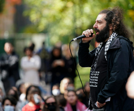 Image of Ahmad Almallah speaking at a pro-Palestine event